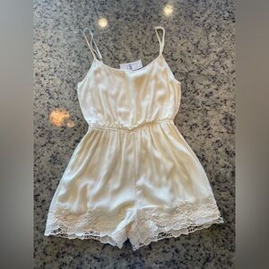 NWT women’s cream, lace trim, romper size S